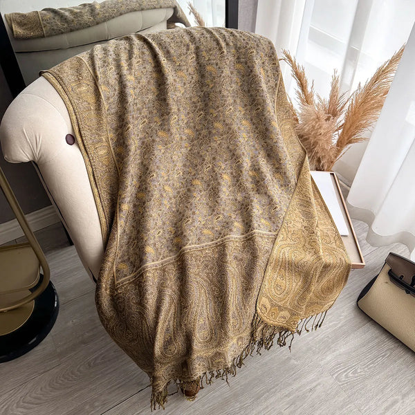 Large paisley pashmina scarf draped elegantly over a chair.
