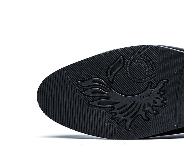Three-quarter view of men's slip-on loafers in premium black leather