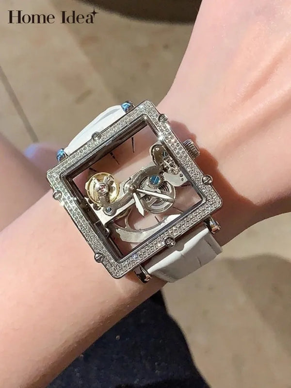 Timeless Pulse watch with transparent case and stainless steel body.
