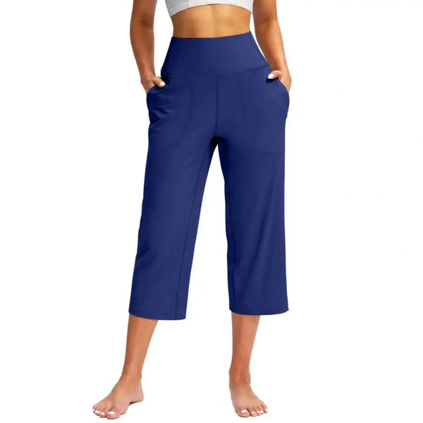 Chic high-waist wide-leg capri yoga pants with pockets, perfect for activewear and casual outings in nylon-spandex blend.