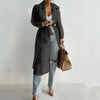 Sheer white trench coat with belt and single-breasted button front for spring layering