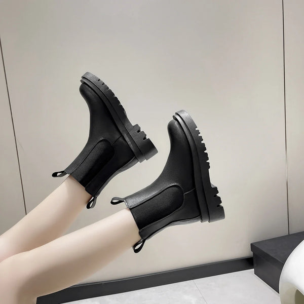 Chic women's Chelsea boots with thick sole, slip-on design, and durable rubber outsole for stylish autumn and spring wear.