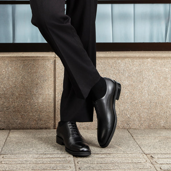Back view of Desai Oxfords, displaying the durable rubber outsole.