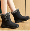 Chic women's waterproof winter boots with plush lining, low heel, and hook-and-loop closure for stylish cold weather comfort.