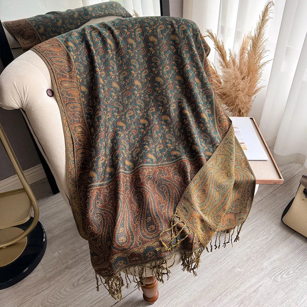 Stylish pashmina scarf with vibrant paisley design and tassels.