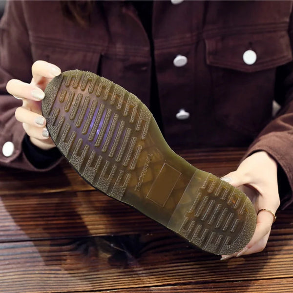 Black tassel loafers designed for both professional and casual settings.