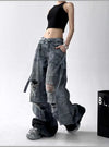 Trendy high-waist wide-leg ripped jeans for women with tie-dye and distressed detailing, perfect for casual street style.