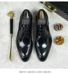 Elegant footwear: black leather Oxfords with a sleek, modern design.