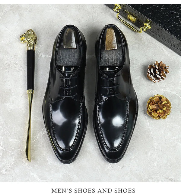 Elegant footwear: black leather Oxfords with a sleek, modern design.