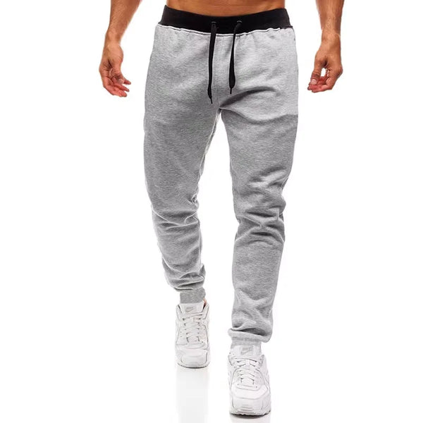 Modern sportswear joggers featuring spliced panels and loose comfortable fit