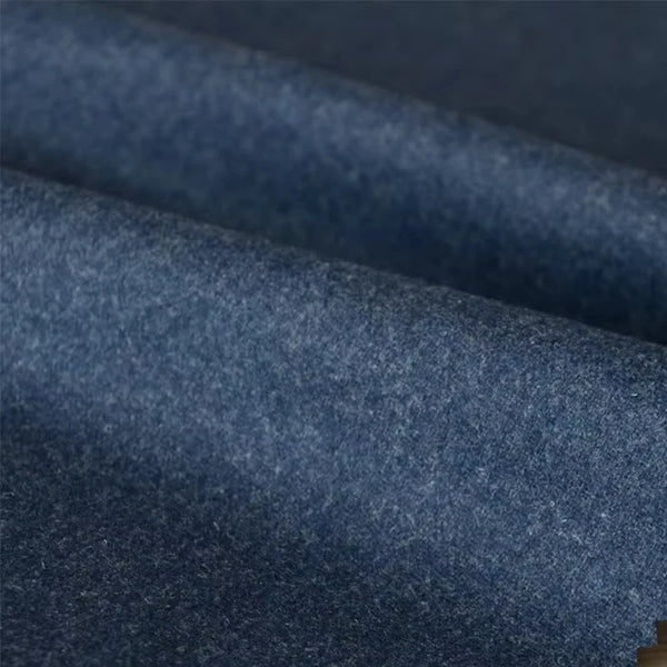 Tailored fit of the blue-grey wool flannel suit showcasing impeccable craftsmanship.