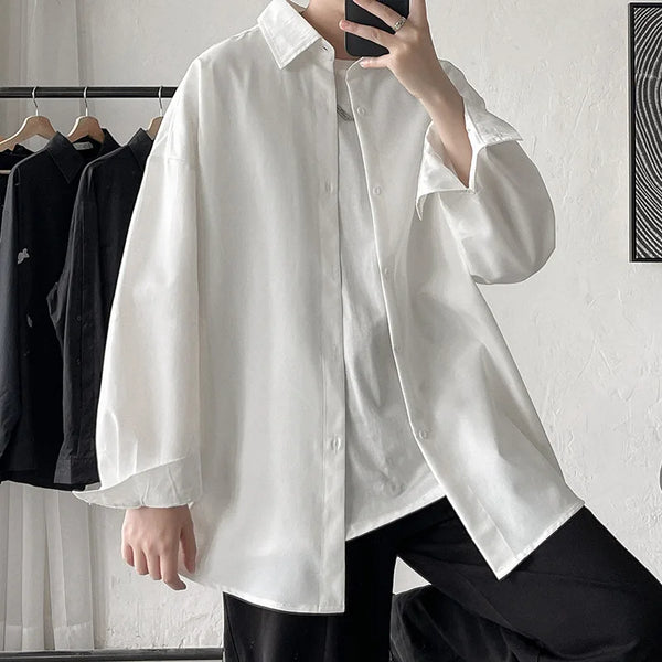 Oversized long sleeve casual shirt for men and women, featuring a Mandarin collar and single-breasted closure in solid color.