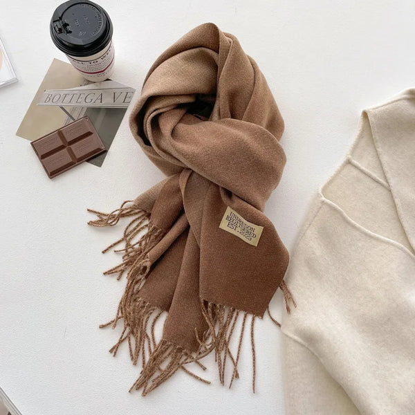 Elegant cashmere-feel shawl in muted rose, perfect for draping and adding style.