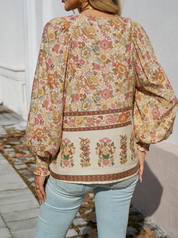 Bohemian lace-up V-neck blouse for women with vibrant print, lantern sleeves, and loose fit, perfect for spring and summer.