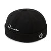 Black adjustable skullcap with vintage-inspired brimless silhouette