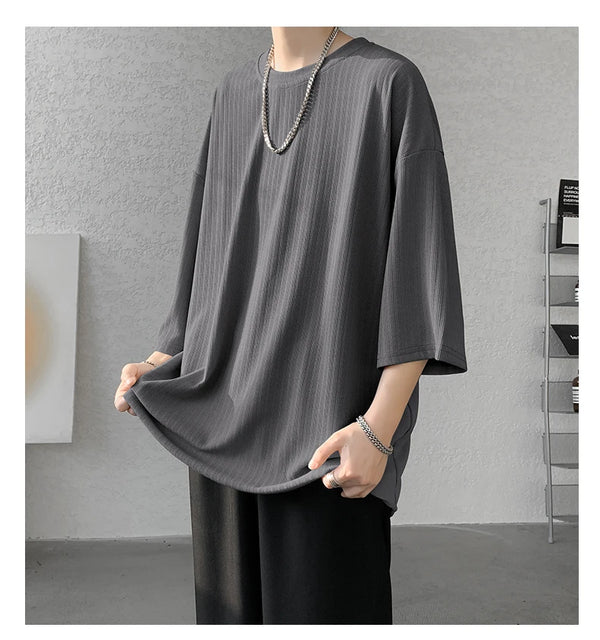 Model in striped summer tee, showcasing its versatility for various summer activities.