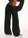 Close-up of quality polyester fabric on wide leg pants, smooth broadcloth texture