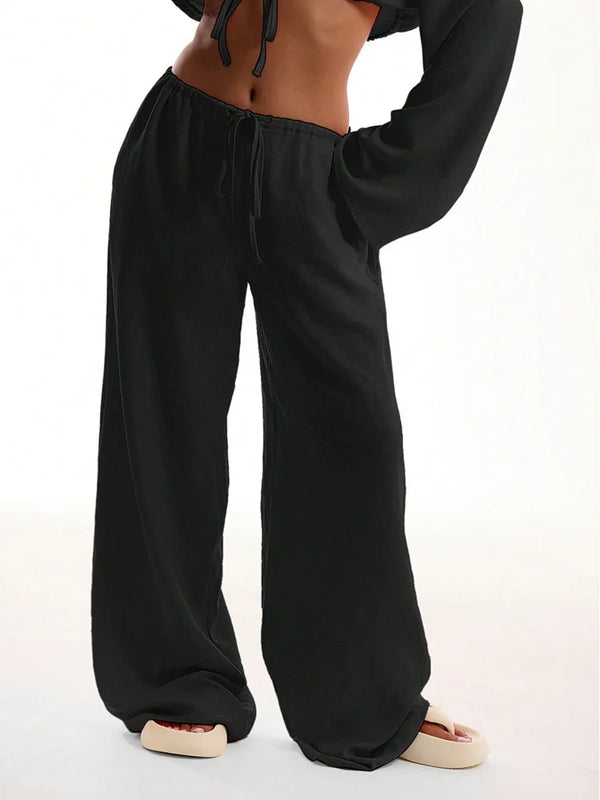 Close-up of quality polyester fabric on wide leg pants, smooth broadcloth texture