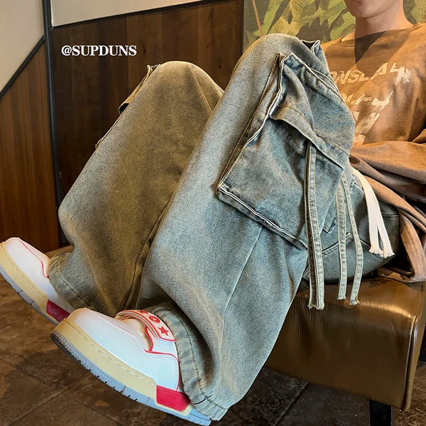 Men's wide-leg hip-hop jeans showcasing premium coated denim material.