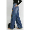 Vintage washed black jeans with loose wide leg and decorative metal hardware