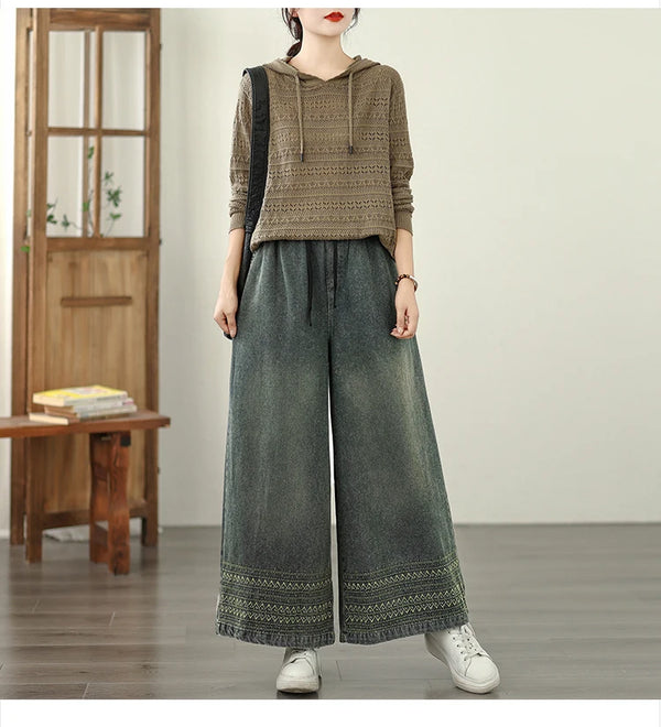 Vintage embroidered wide-leg jeans for women, featuring elastic waist, ethnic design, and light wash for autumn fashion.