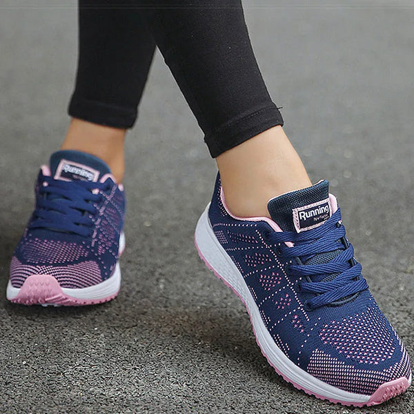 Cushioned white athletic footwear with playful multi-color trim