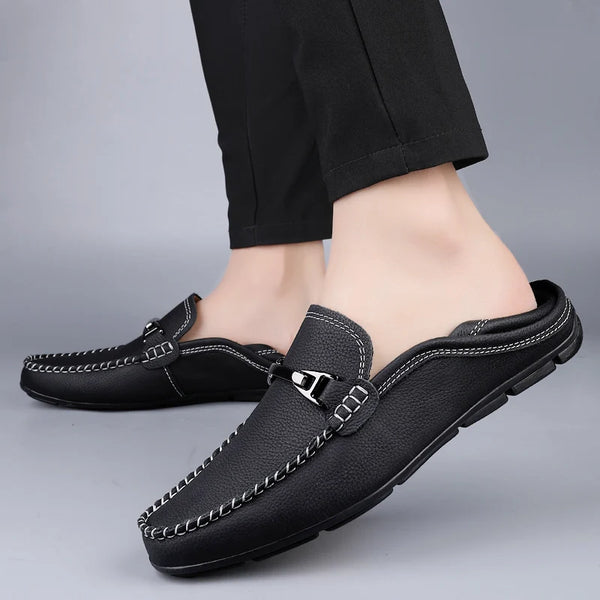 Fashionable black loafers for men with breathable mesh and rubber sole.