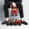 Side view of men's double monk strap loafers showcasing premium materials.