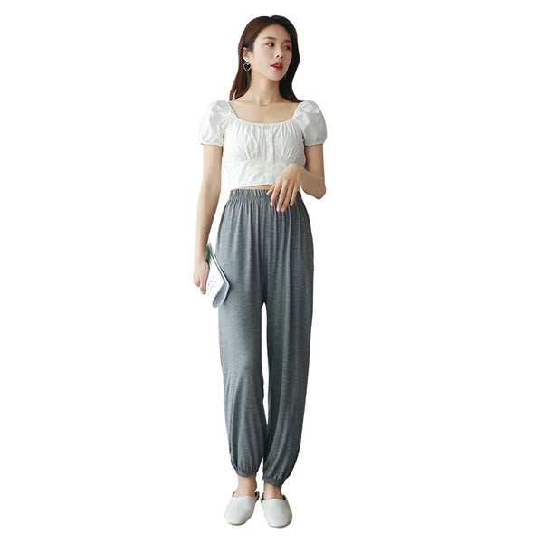 Comfy modal women's pajama pants with elastic waistband, ankle-length design, perfect for lounging and sleep in all seasons.
