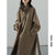 Classic woolen outerwear with adjustable belt and refined collar detail