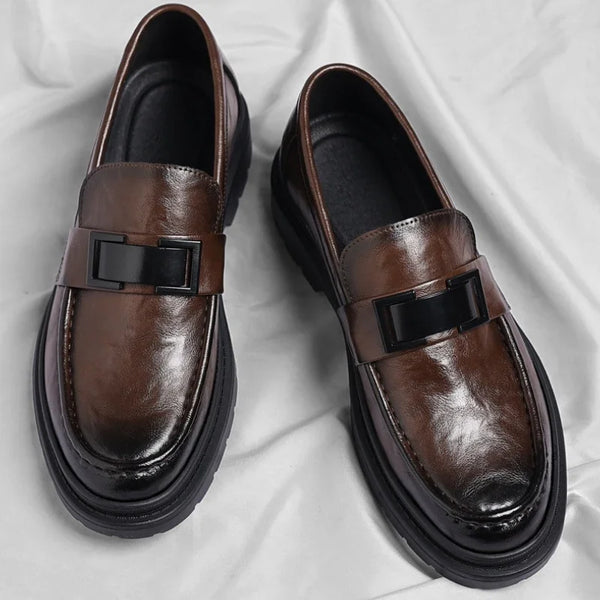 Close-up of men's slip-on dress loafers showcasing premium split leather.
