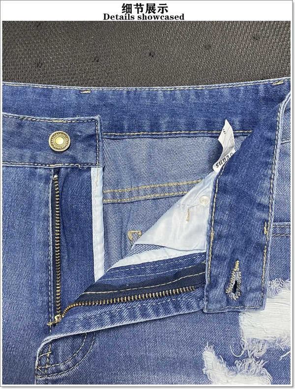 Casual blue jean shorts featuring artisan rips and fringe detailing throughout