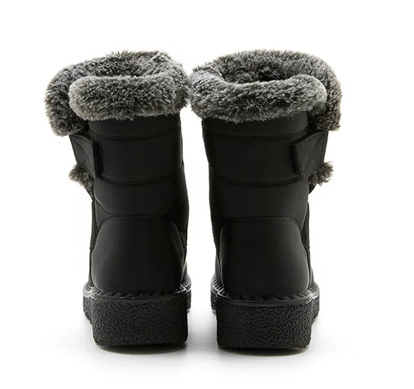 Chic women's waterproof winter boots with plush lining, low heel, and hook-and-loop closure for stylish cold weather comfort.