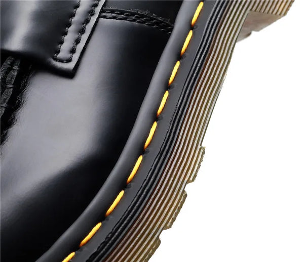 Black tassel loafers with a chic look for fashionable outings.