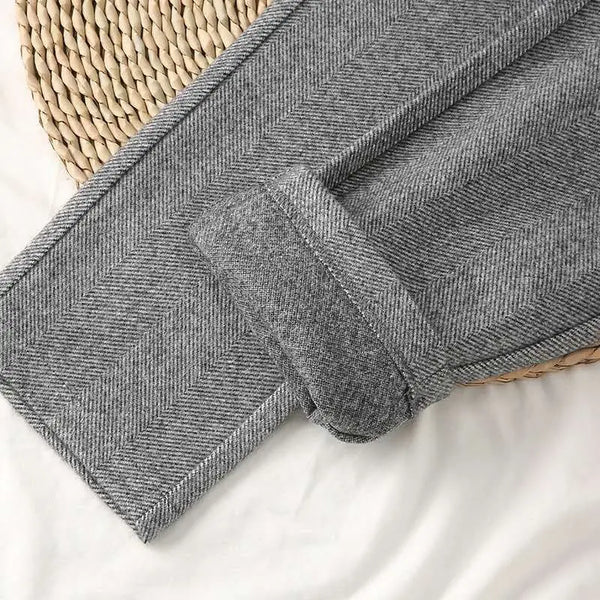 Full-length high-waist trousers with functional button closure and pockets for polished everyday looks