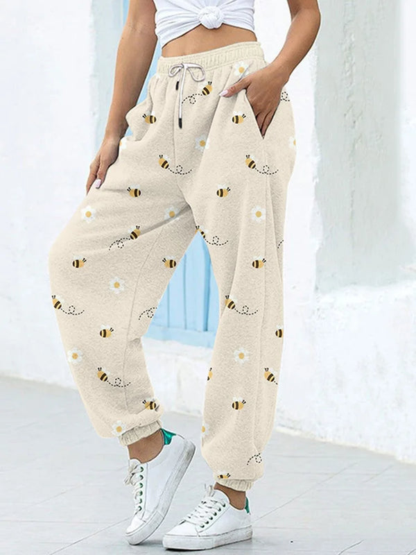 Chic high-waist joggers with 3D geometric print, pockets, and elastic drawstring for comfort and style in any season.