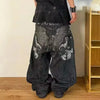 Casual blue jeans with artistic embroidery, perfect for any outfit.