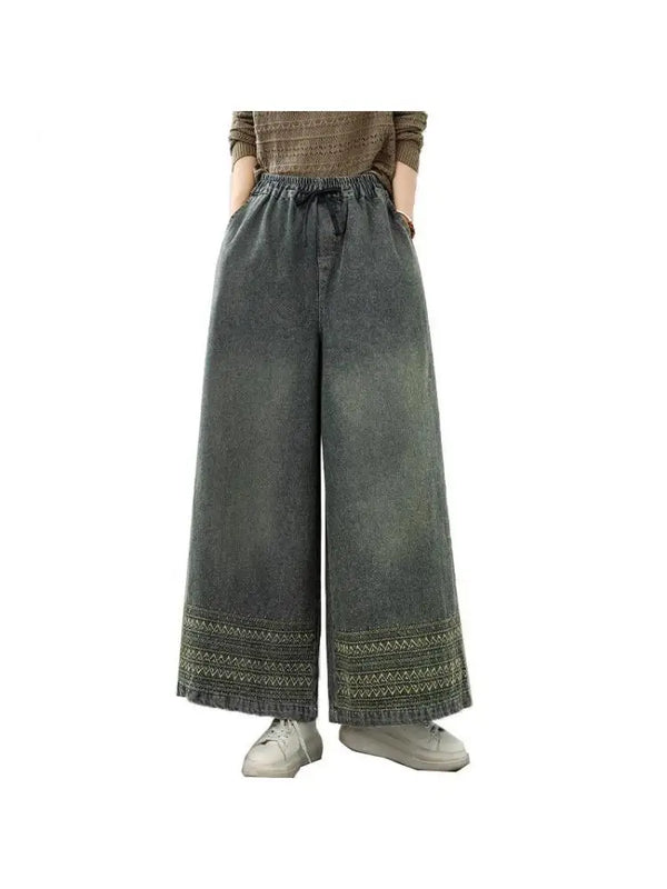 Vintage embroidered wide-leg jeans for women in light wash, featuring elastic waist and ethnic-inspired design for autumn fas
