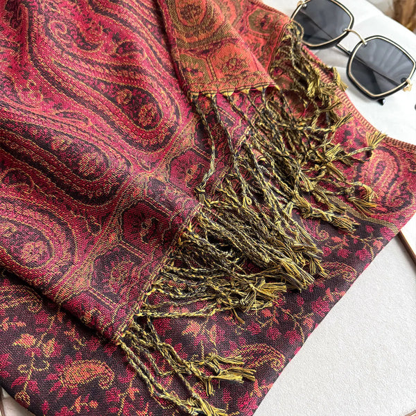 Close-up of soft polyester fabric on elegant paisley pashmina.