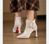 Pair of sophisticated pointed pumps with belt buckle accent and high heel