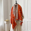 Cashmere shawl with artful florals, adding elegance to any winter outfit.