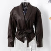 Chic belted leather bomber jacket for women, featuring lace-up detail and hood, perfect for autumn and winter fashion.