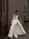 Model styling white satin two-piece set for versatile spring and summer wear