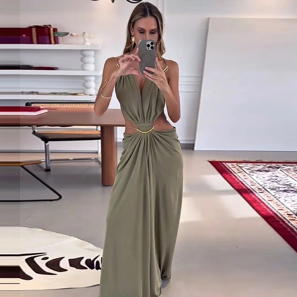 Special occasion dress featuring halter top, exposed back, and waist cutout accents
