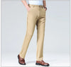Full-length view of high drape dress pants creating polished silhouette from waist to ankle