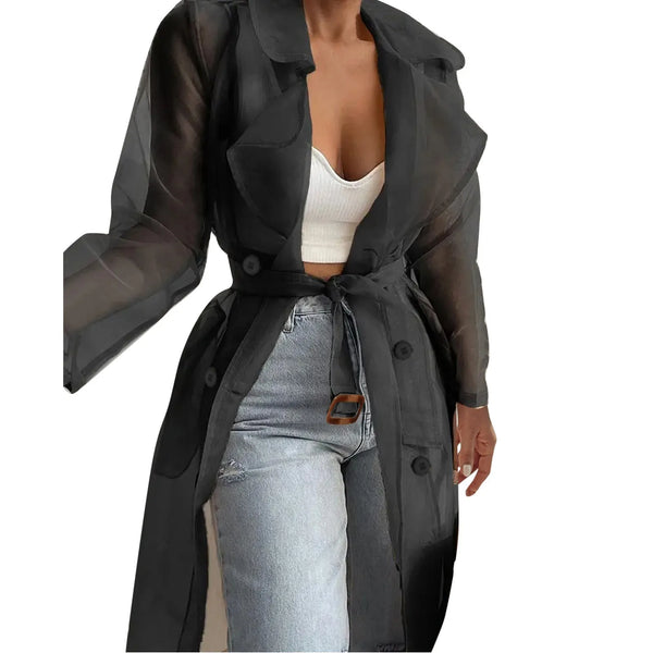 Woman styling belted trench coat with midi skirt for versatile spring look