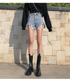 Summer denim shorts featuring high rise waist and edgy ripped details throughout