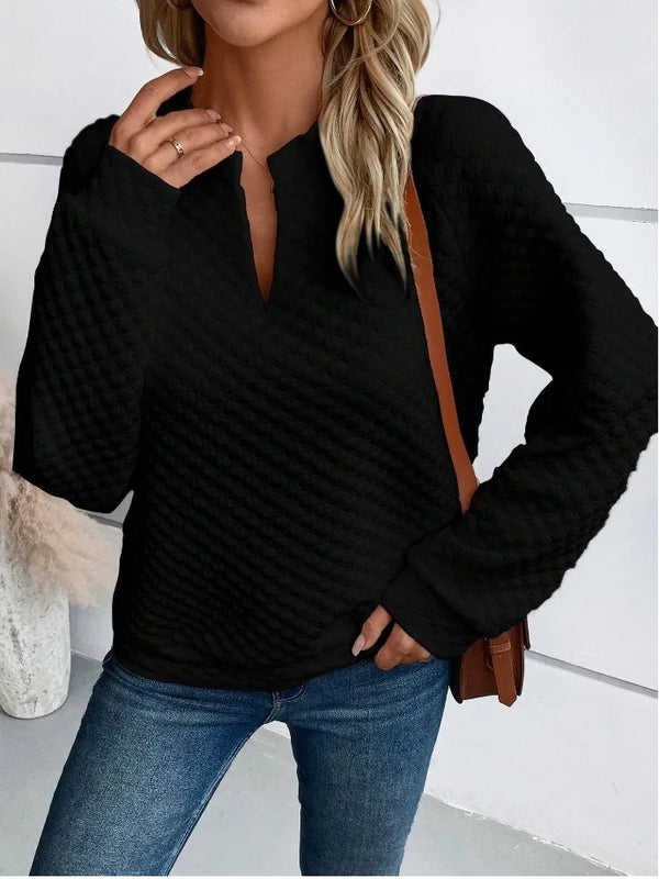 Deep V-neck hoodie with relaxed drape and soft texture