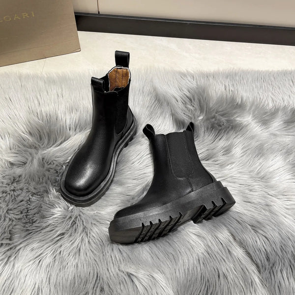 Chic women's Chelsea boots with thick sole, slip-on design, and durable rubber outsole for stylish autumn and spring wear.
