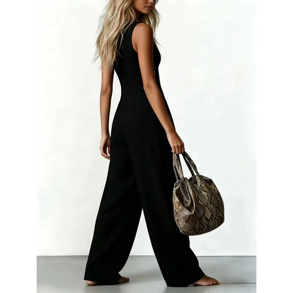 Casual button-front denim jumpsuit in soft polyester fabric with relaxed wide leg fit
